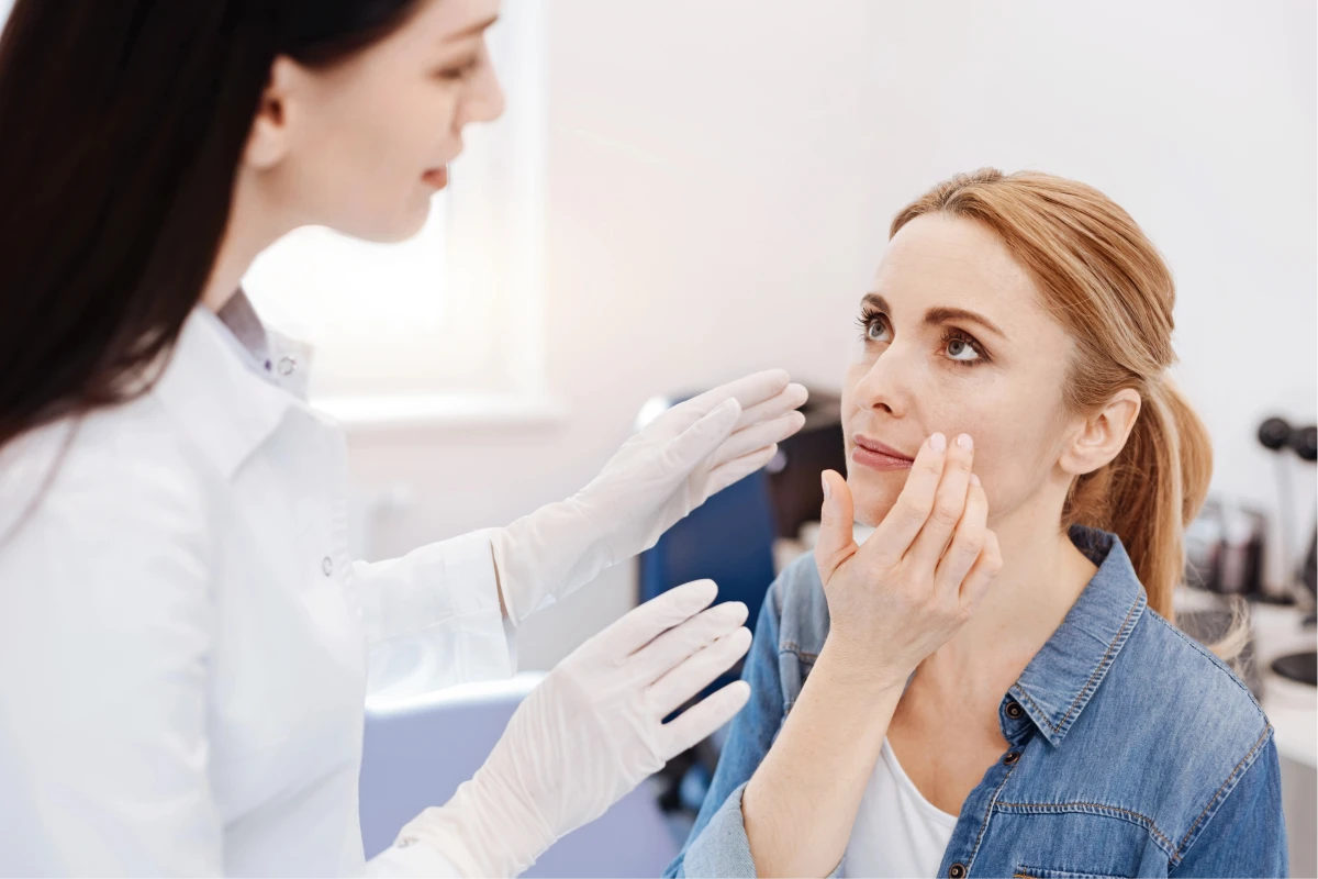 Pharmacist performing a skin consultation and facial treatment